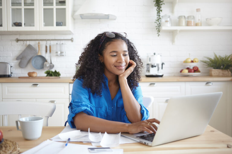 Woman using BMS Pay Payment Portal from her home